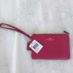 Pink leather Coach wristlet